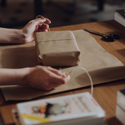 Someone Wrapping a Book
