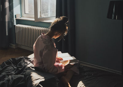 A Girl Reading Her Book